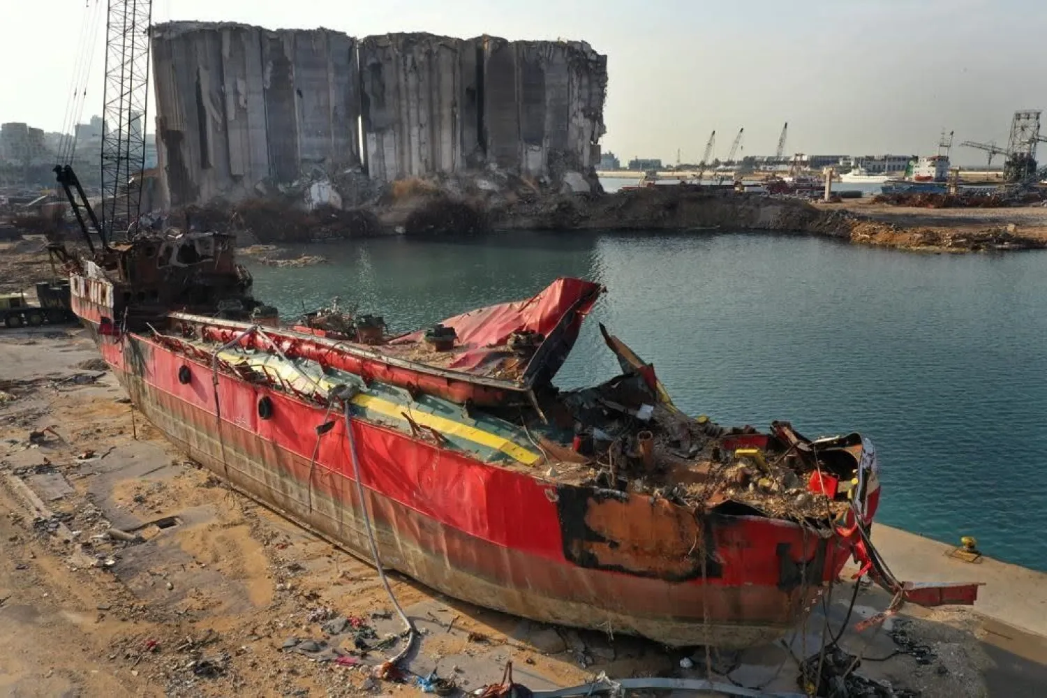 A destroyed ship lies near towering grain silos gutted in the massive August explosion at the Beirut port that claimed the lives of more than 200 people, in Beirut, Lebanon, Wednesday, Dec. 2, 2020. (AP)