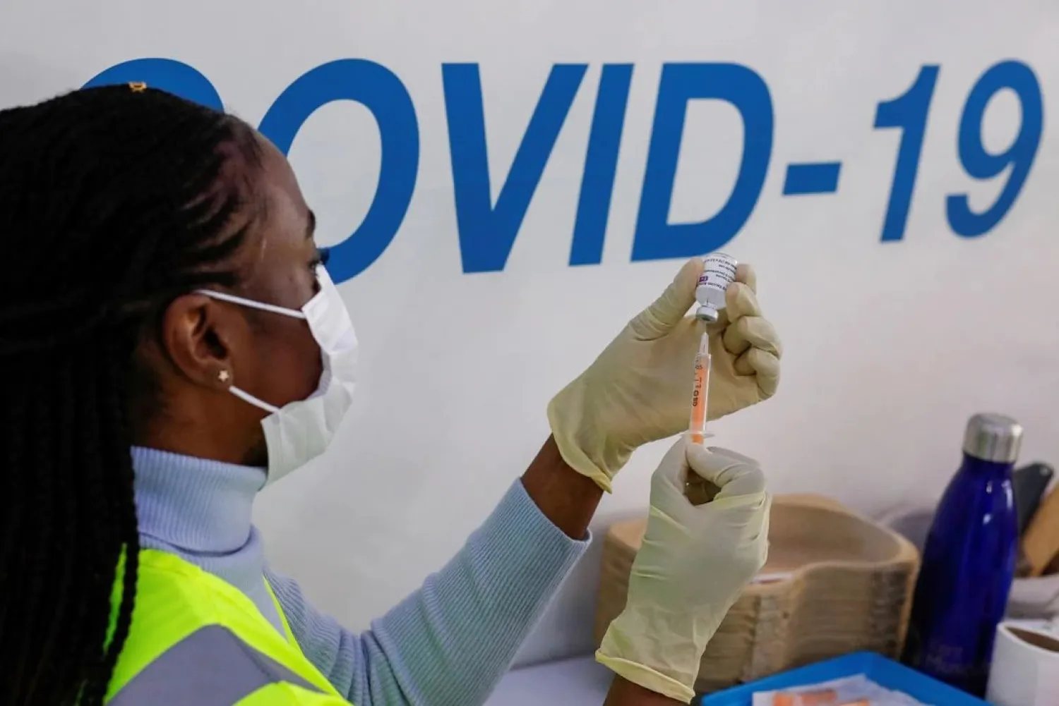 A dose of AstraZeneca vaccine is prepared at COVID-19 vaccination center in the Odeon Luxe Cinema in Maidstone, Britain February 10, 2021. (Reuters)