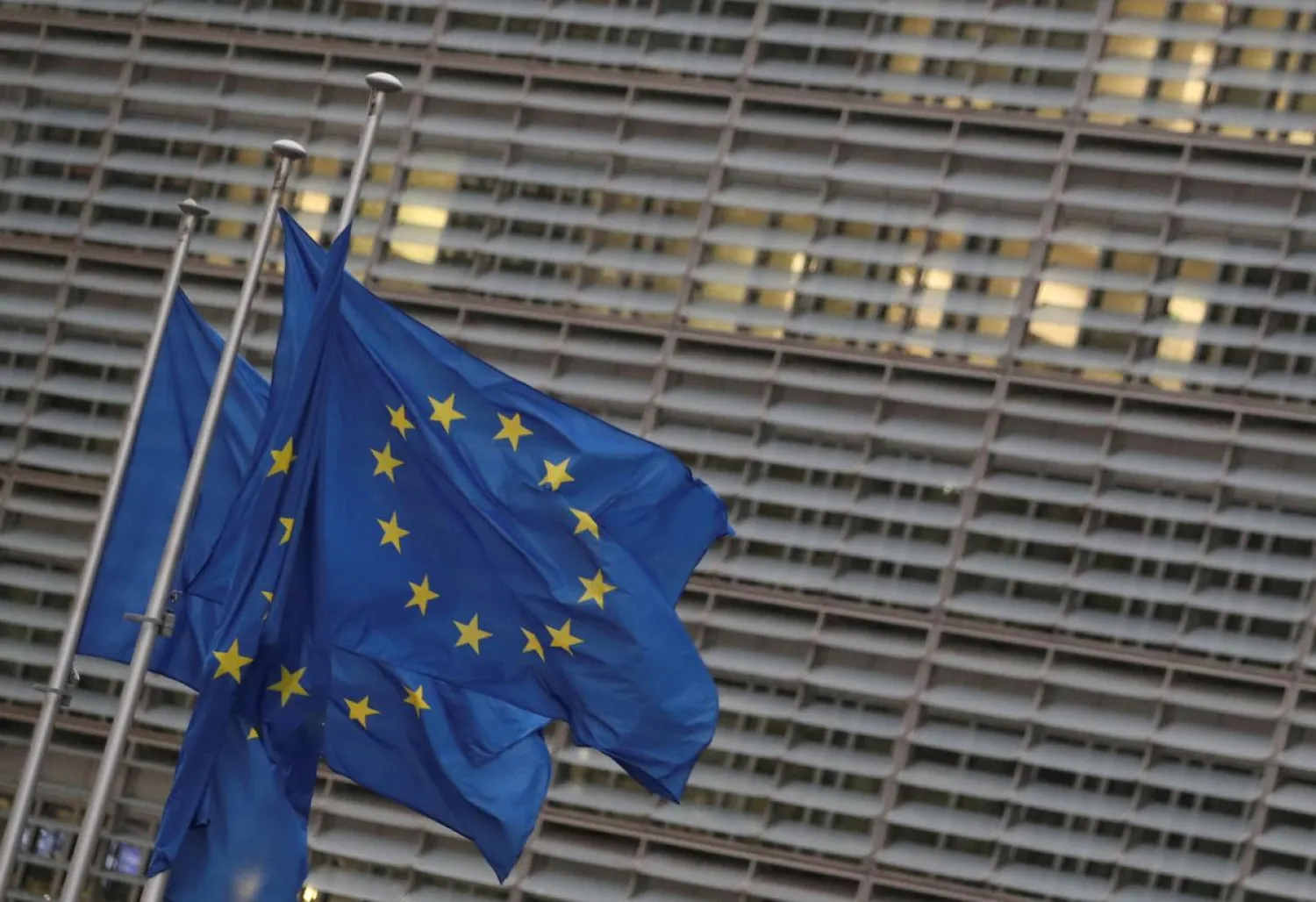 European Union flags flutter outside the European Commission headquarters, where Brexit talks are taking place, in Brussels, Belgium, December 24, 2020. REUTERS