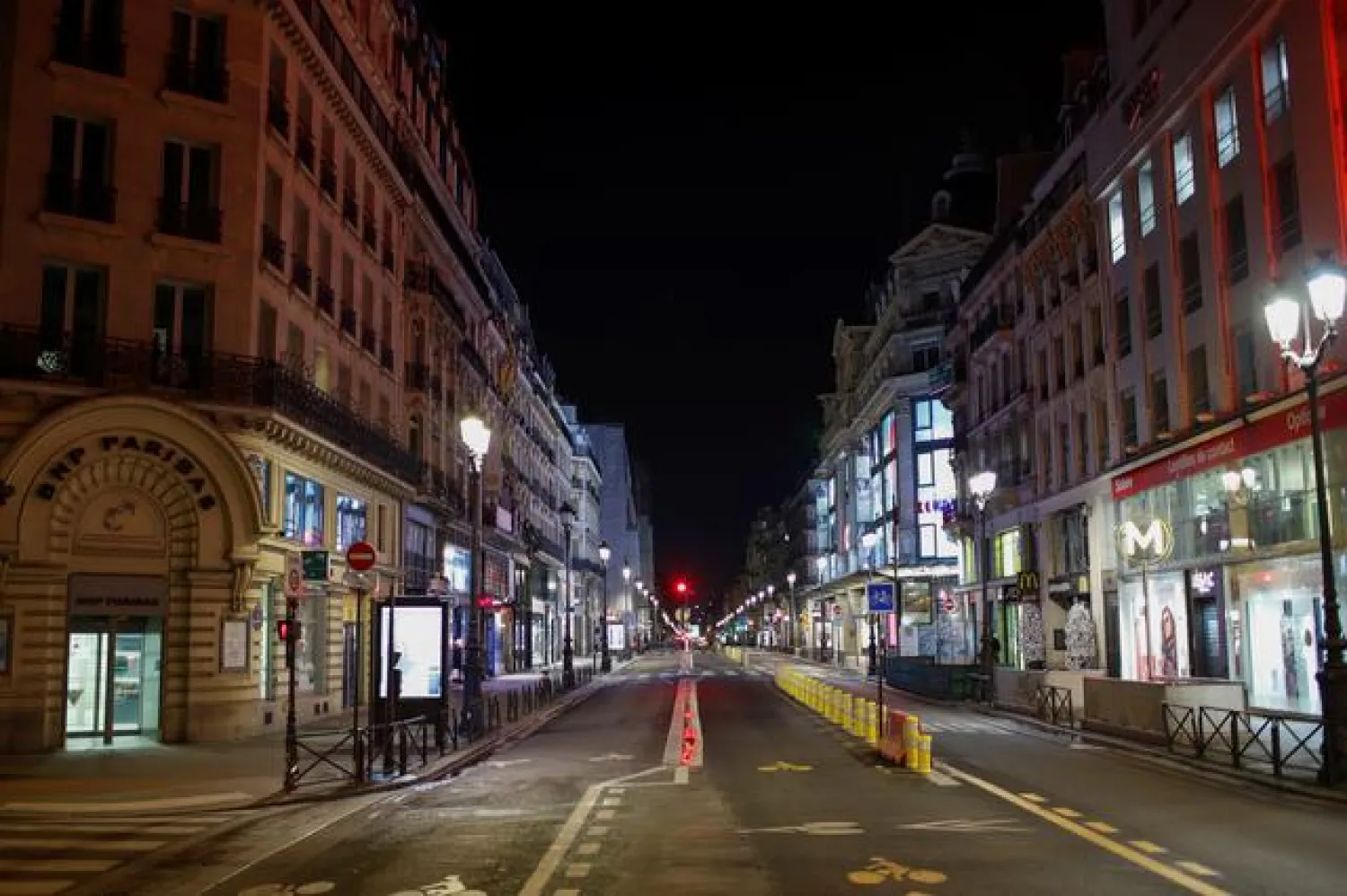 FILE PHOTO: A view shows the deserted Rue de Rivoli in Paris during a nationwide curfew from 8 p.m. to 6 a.m. in France, December 15, 2020. REUTERS/Gonzalo Fuentes/File Photo