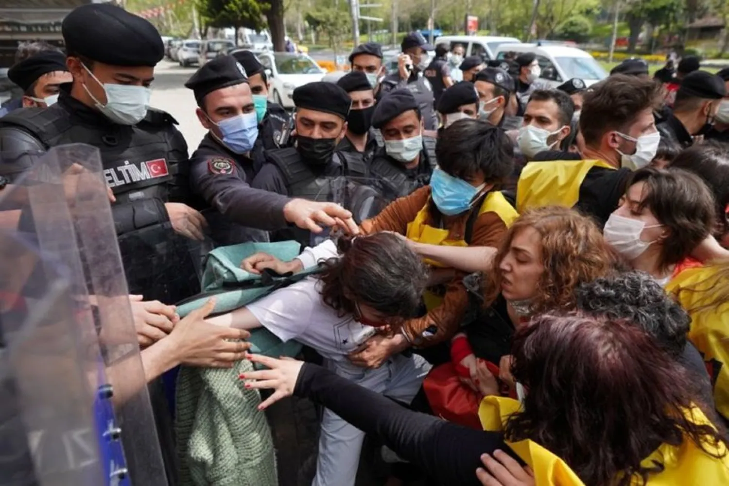 Turkish riot police officers scuffle with demonstrators as they attempt to defy a ban and march on Taksim Square to celebrate May Day, in Istanbul, Turkey May 1, 2021. (Reuters)