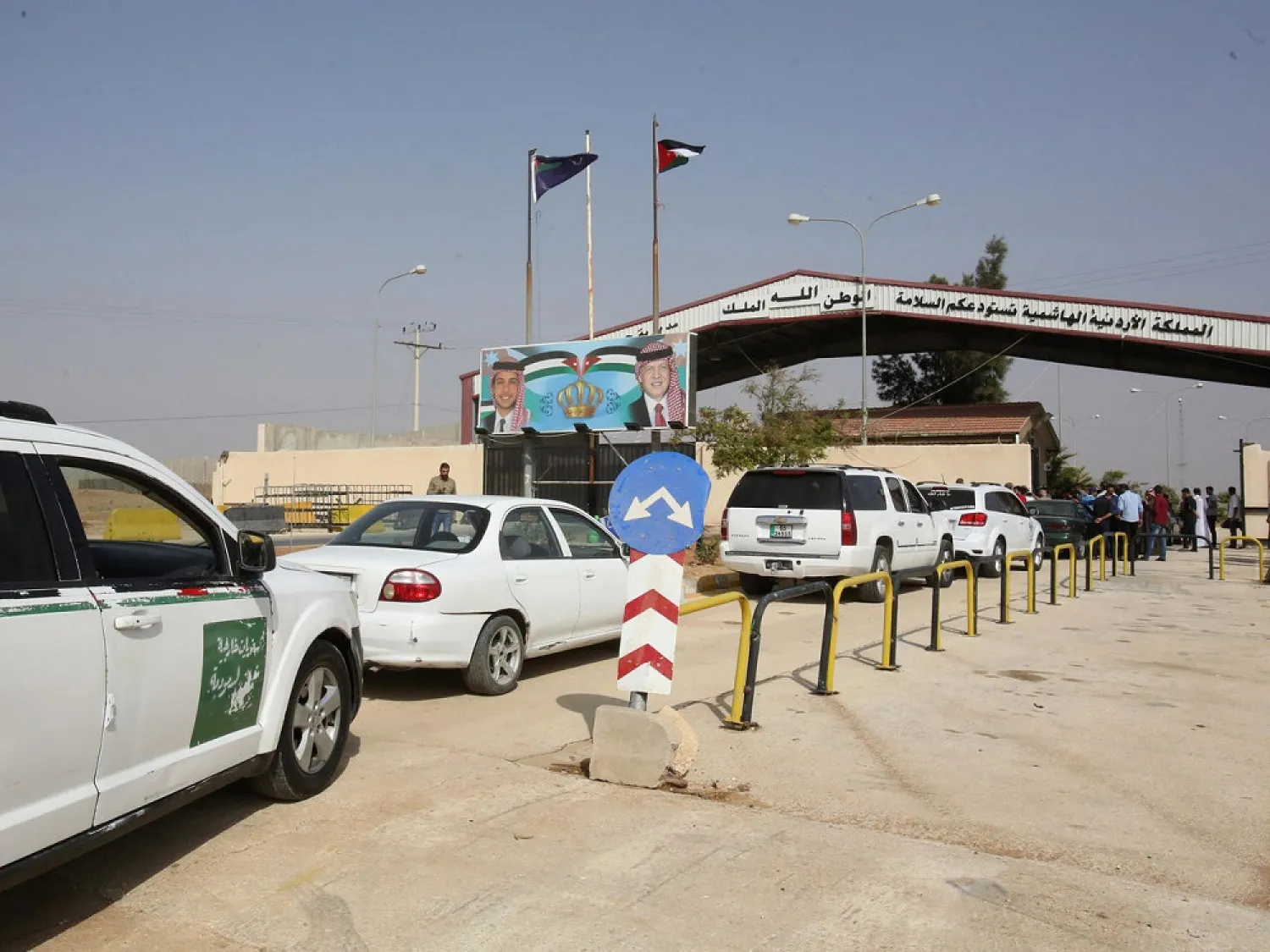 Vehicles arrive at the Jaber border crossing between Jordan and Syria (Nassib crossing on the Syrian side) in the Jordanian Mafraq governorate in 2018. (AFP)