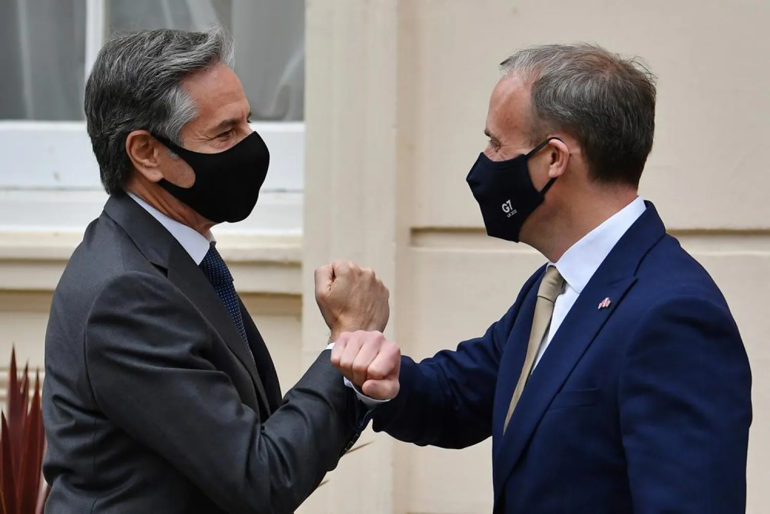 Britain's Foreign Secretary Dominic Raab, right, welcomes U.S. Secretary of State Antony Blinken ahead of bilateral talks as part of the G7 foreign ministers meeting near London, Monday May 3, 2021. (Ben Stansall / Pool via AP)
