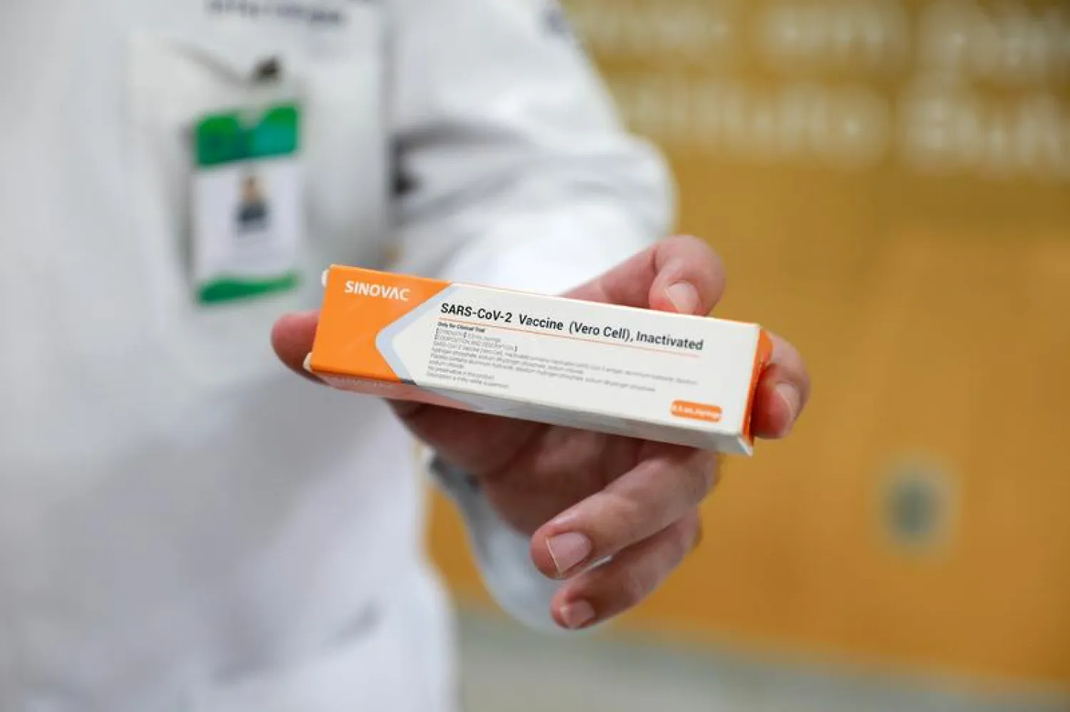 FILE PHOTO: A doctor holds a box of China's Sinovac vaccine, a potential vaccine for the coronavirus disease (COVID-19), at the Sao Lucas Hospital of the Pontifical Catholic University of Rio Grande do Sul (PUCRS), in Porto Alegre, Brazil August 8, 2020. REUTERS/Diego Vara

