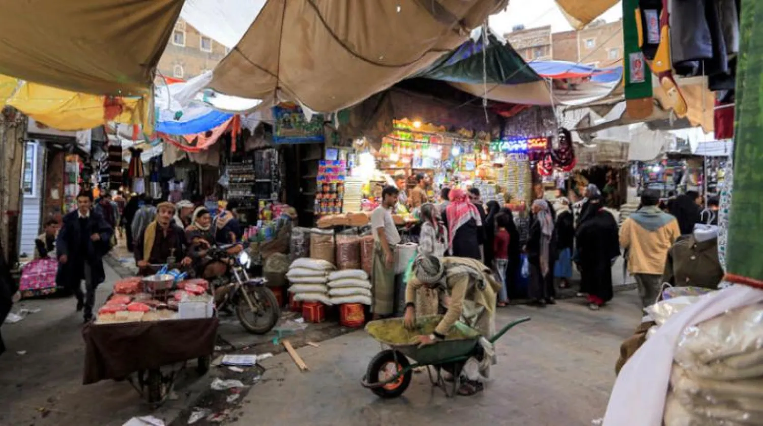 Yemenis shop at a market in Sanaa ahead of Eid al-Fitr next week. (AFP)
