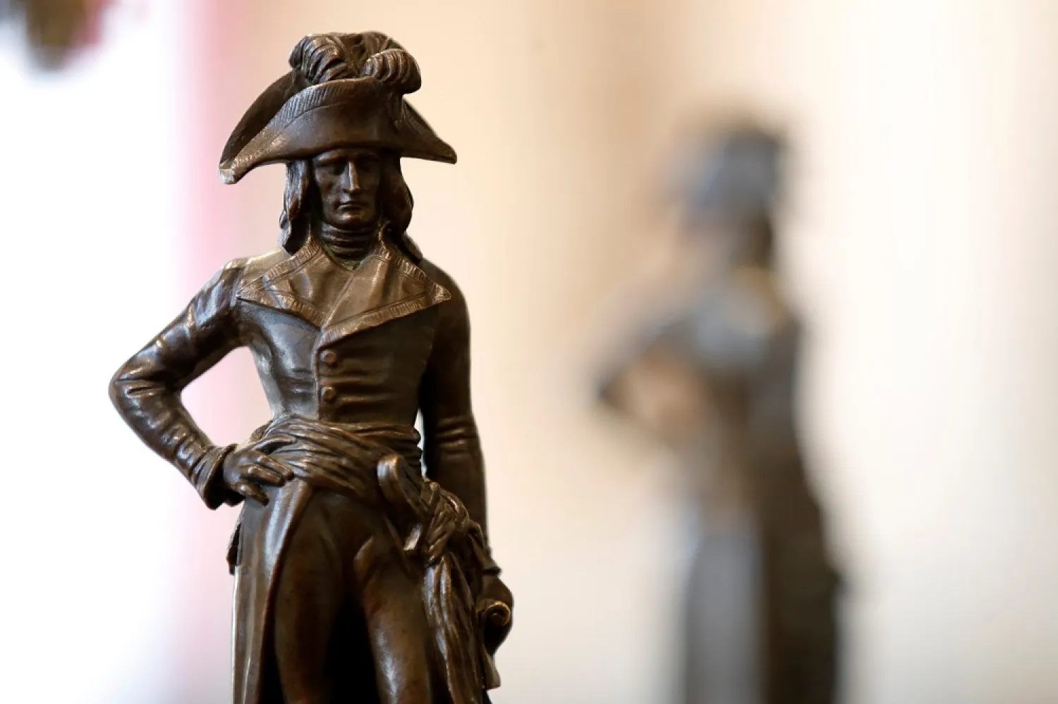 A bronze statue of Napoleon Bonaparte in uniform displayed at Osenat auction house before being put on auction, in Fontainebleau, near Paris, France, April 30, 2021. (Reuters)