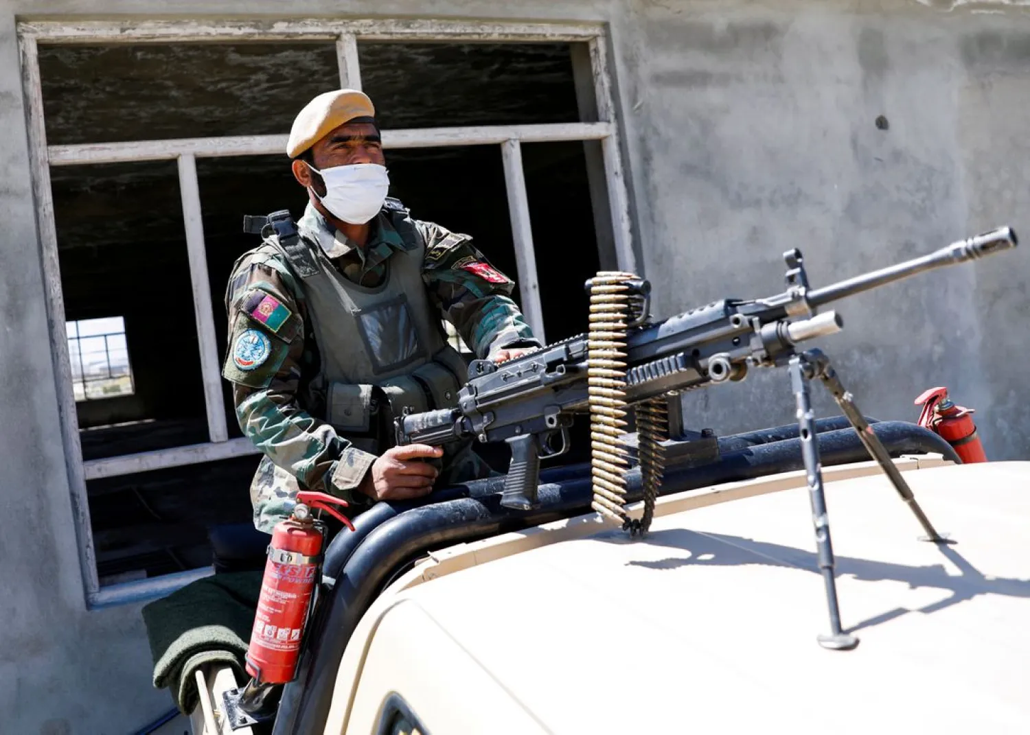 An Afghan National Army soldier sits on a back of an army vehicle at a checkpoint on the outskirts of Kabul, Afghanistan April 21, 2021. (Reuters)