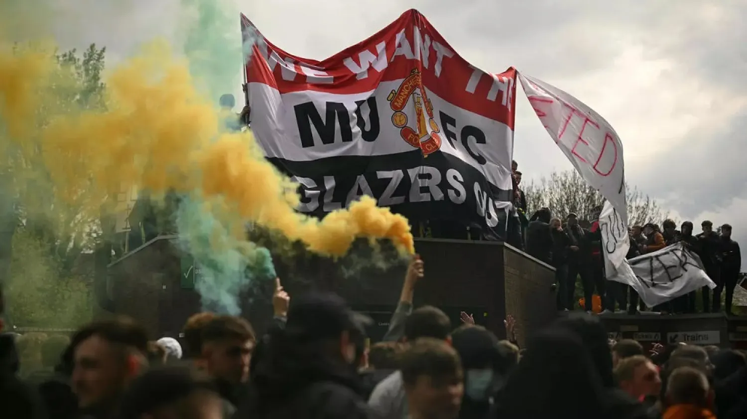 Fans protest against Manchester United's owners, outside English Premier League club Manchester United's Old Trafford stadium in Manchester on May 2, 2021. (AFP)