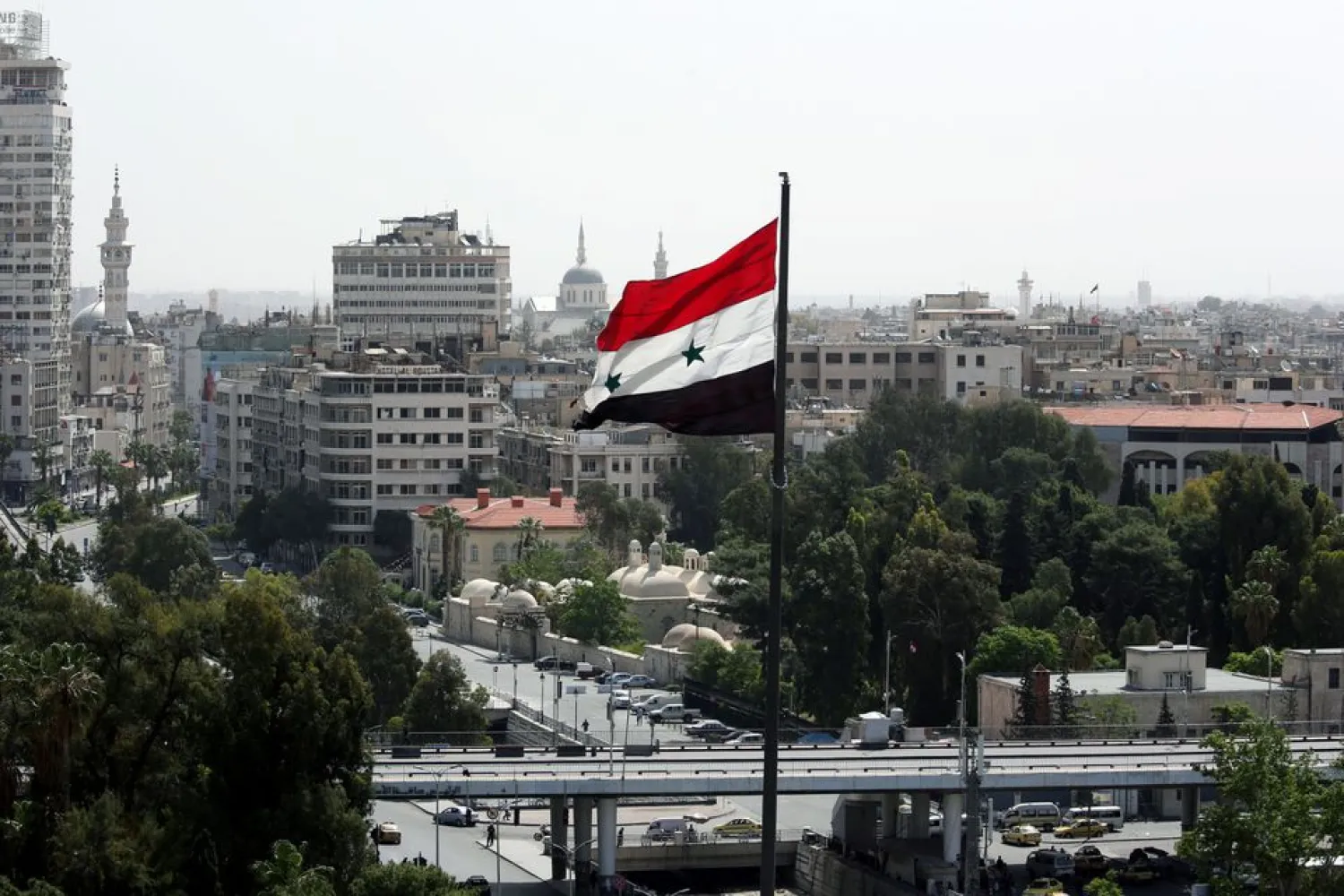A Syrian flag flutters in Damascus, Syria April 20, 2018. REUTERS/Ali Hashisho
