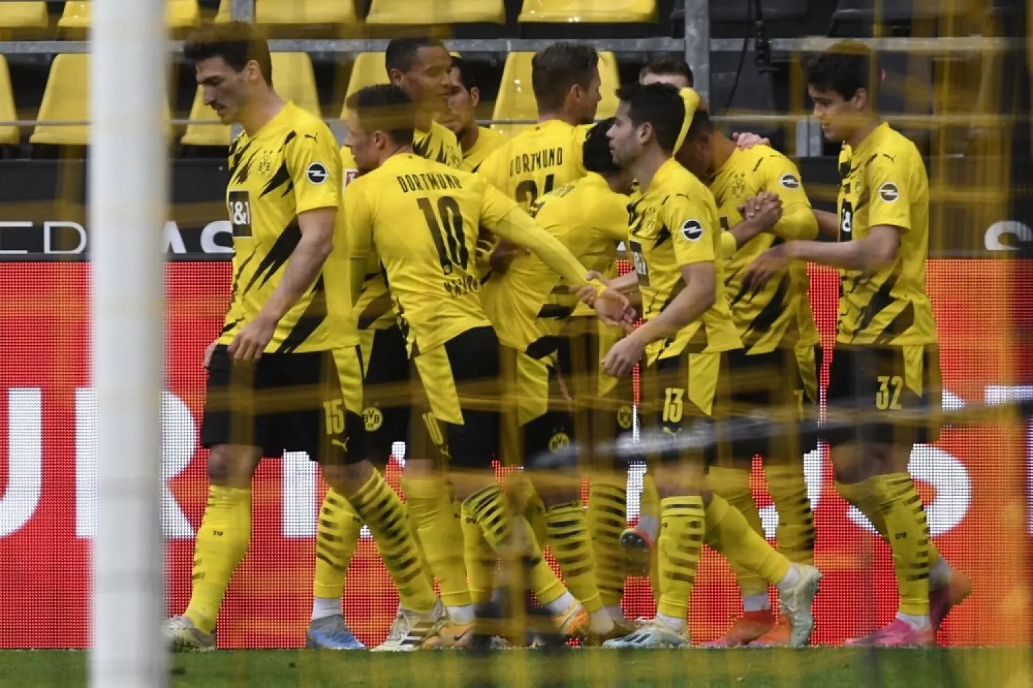 Dortmund players celebrate scoring their second goal against Leipzig. (dpa)
