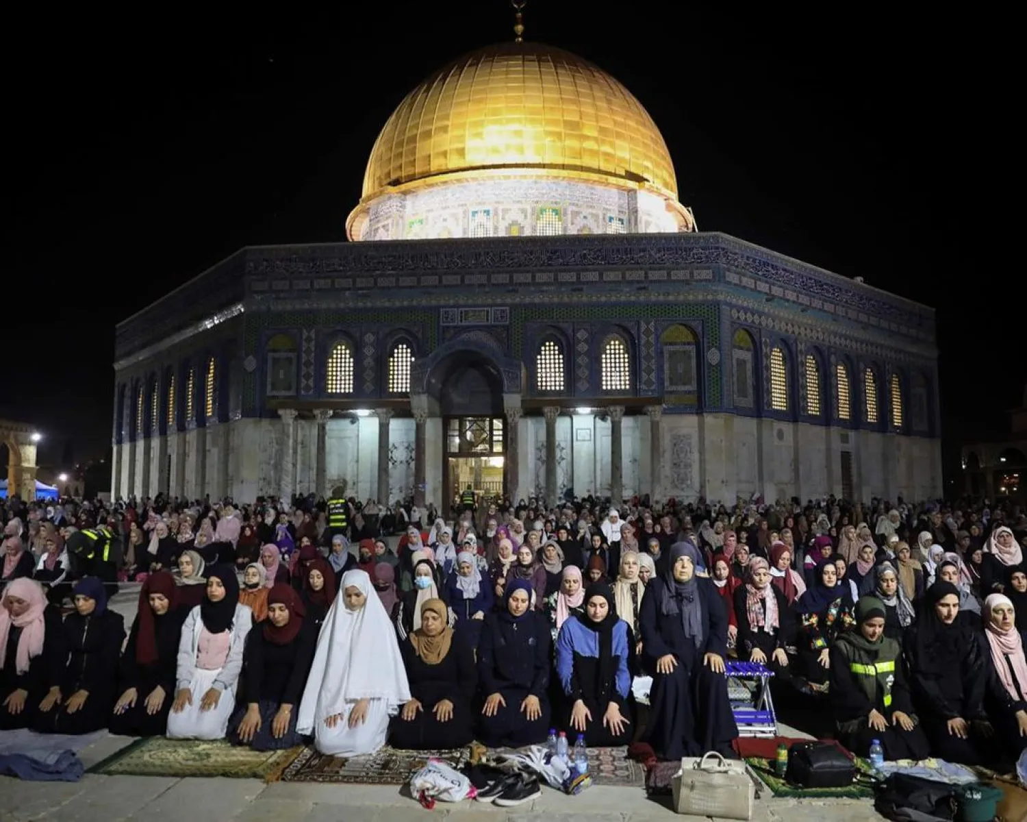 Palestinians pray on Laylat al-Qadr (Night of Destiny) outside the Dome of the Rock in Jerusalem's Al-Aqsa Mosque compound during the Muslim holy month of Ramadan on May 8, 2021 | AFP