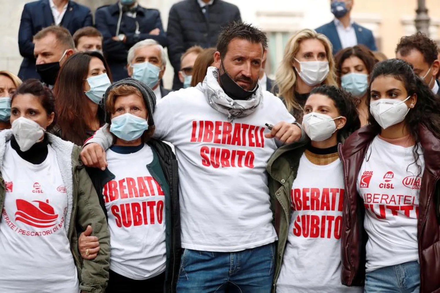 Relatives of 18 fishermen detained in Libya and Marco Marrone the owner of one of the boats seized, are seen during a protest demanding the release of the sailors, in front of parliament, in Rome, Italy, October 14, 2020. Picture taken October 14, 2020. REUTERS/Yara Nardi/File Photo 

