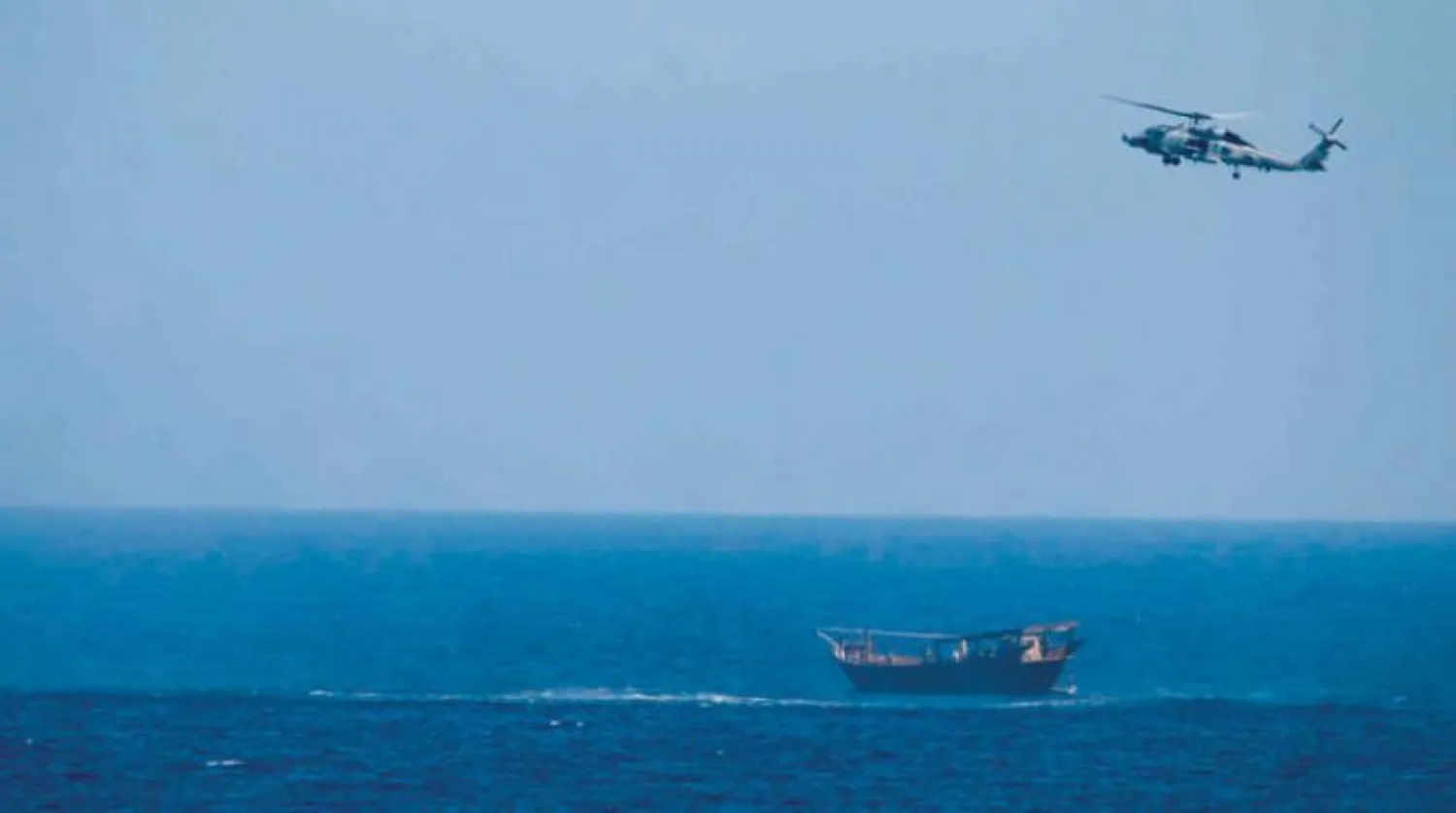 A US helicopter flies over the seized vessel. (AP)