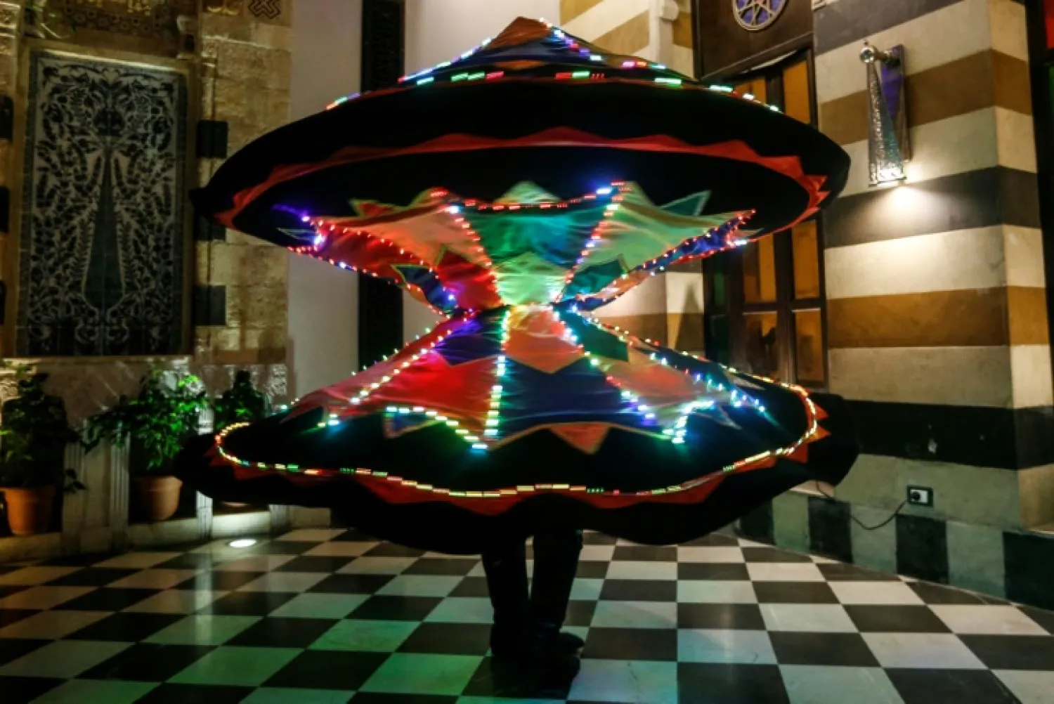 Muayad al-Kharrat says he can twirl 400 times per minute "without moving an inch away from the axis" to make a livelihood but also to seek inner peace in war-scarred Syria - AFP