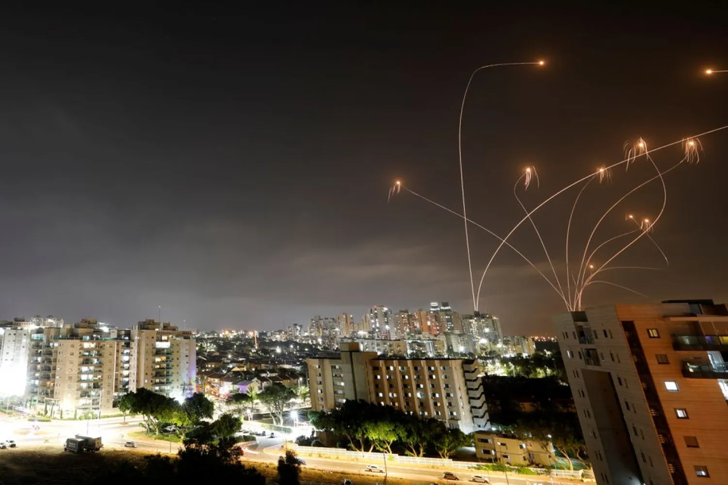 Streaks of light are seen as Israel's Iron Dome anti-missile system intercepts rockets launched from the Gaza Strip towards Israel, as seen from Ashkelon, Israel May 10, 2021. (Reuters)