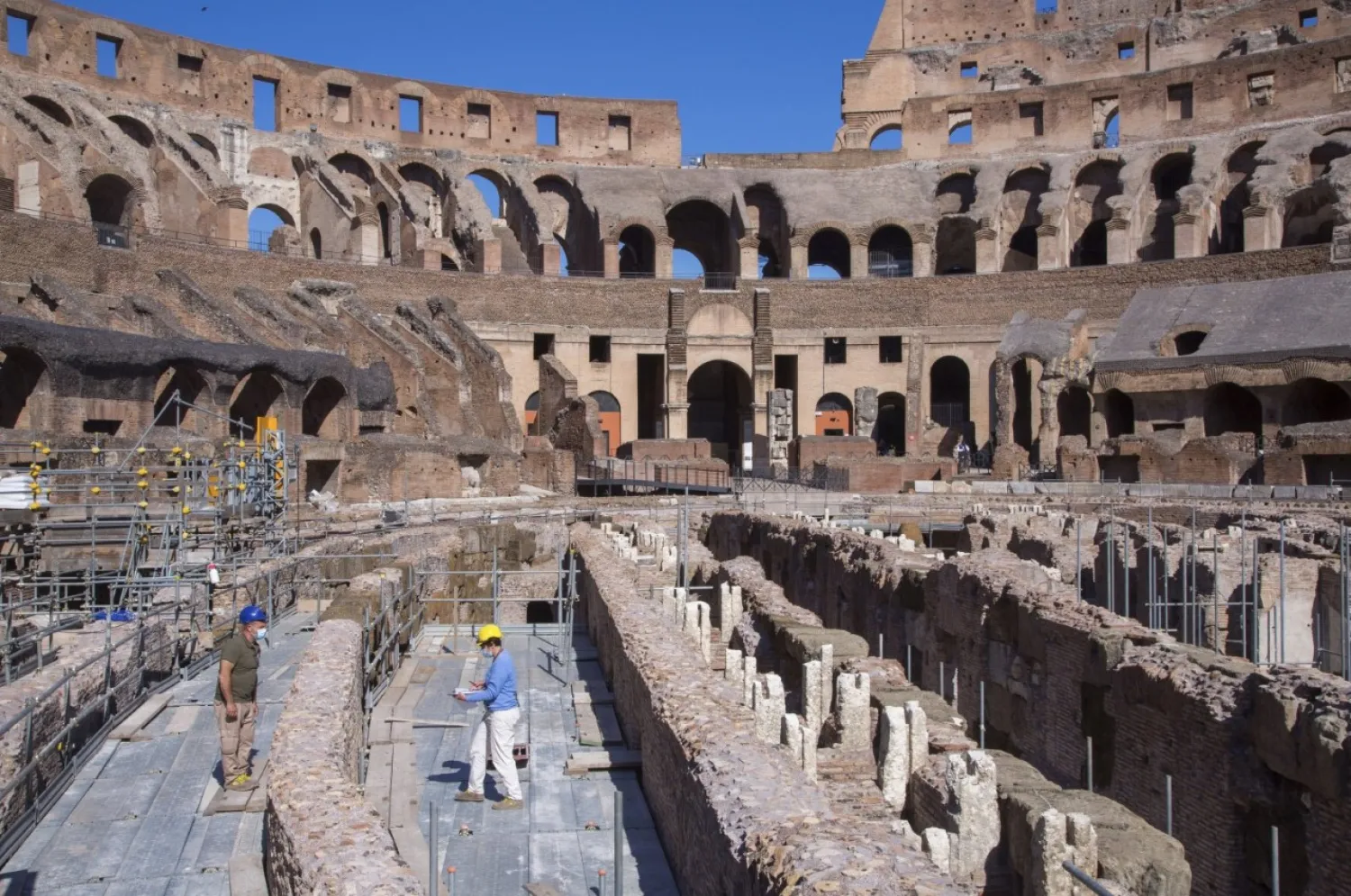 Restorers work inside the Colosseum in Rome, June 1, 2020. (AP Photo)