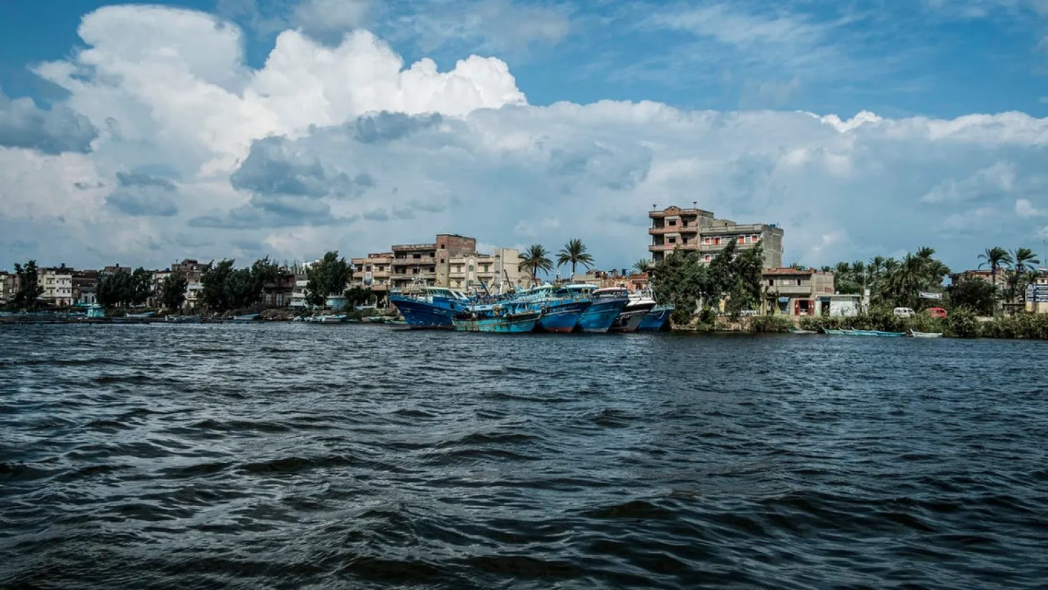 This picture taken on October 24, 2019 shows a view of boats moored by the town of Borg Megheizel, lying on the Rosetta branch of the Nile river delta in Egypt's northern Kafr el-Sheikh Governorate, some 55 kilometers northeast of Alexandria. (AFP)
