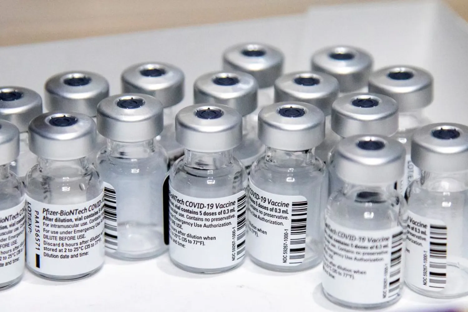 Empty vials of the Pfizer-BioNTech coronavirus disease (COVID-19) vaccine are seen at The Michener Institute, in Toronto, Canada January 4, 2021. REUTERS/Carlos Osorio