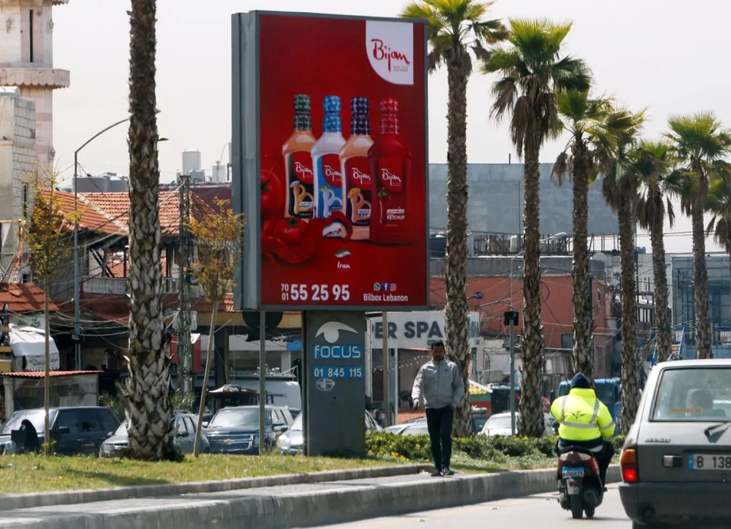 A man walks past an advertising billboard in Beirut suburbs, Lebanon April 16, 2021. REUTERS/Stringer