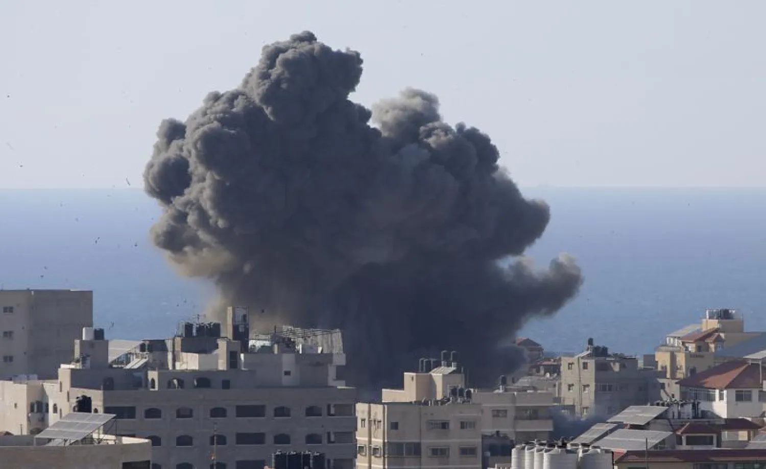 Smoke rises following Israeli airstrikes on a building in Gaza City, Friday, May 14, 2021. (AP Photo/Hatem Moussa)
