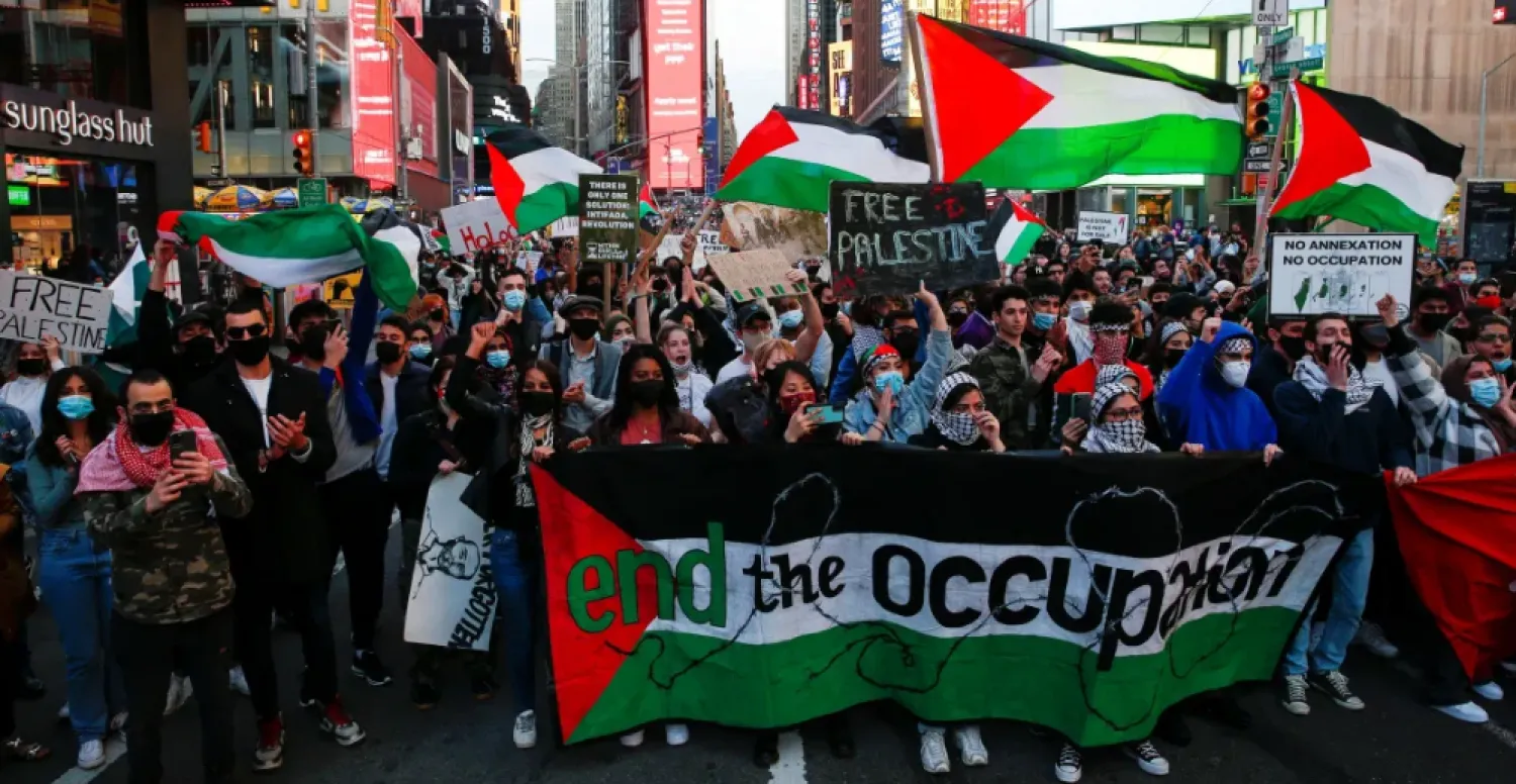 FILE: People in London also expressed their solidarity with Palestinians. [Toby Melville/Reuters]