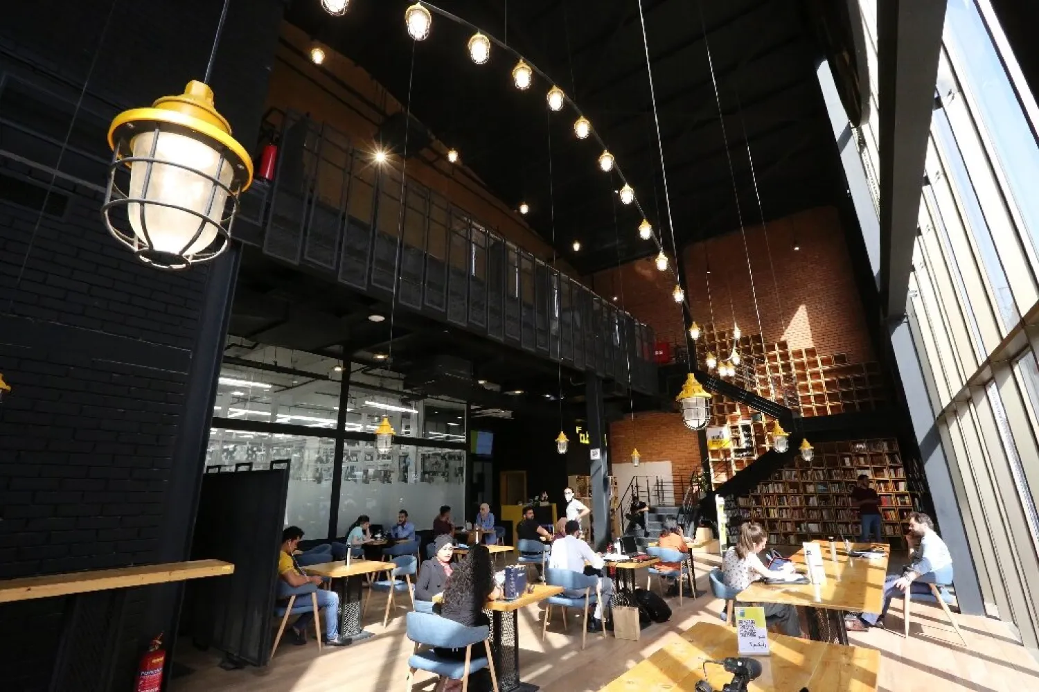 Iraqis tap away at computers and mobile devices at co-working space The Station in Baghdad - AFP