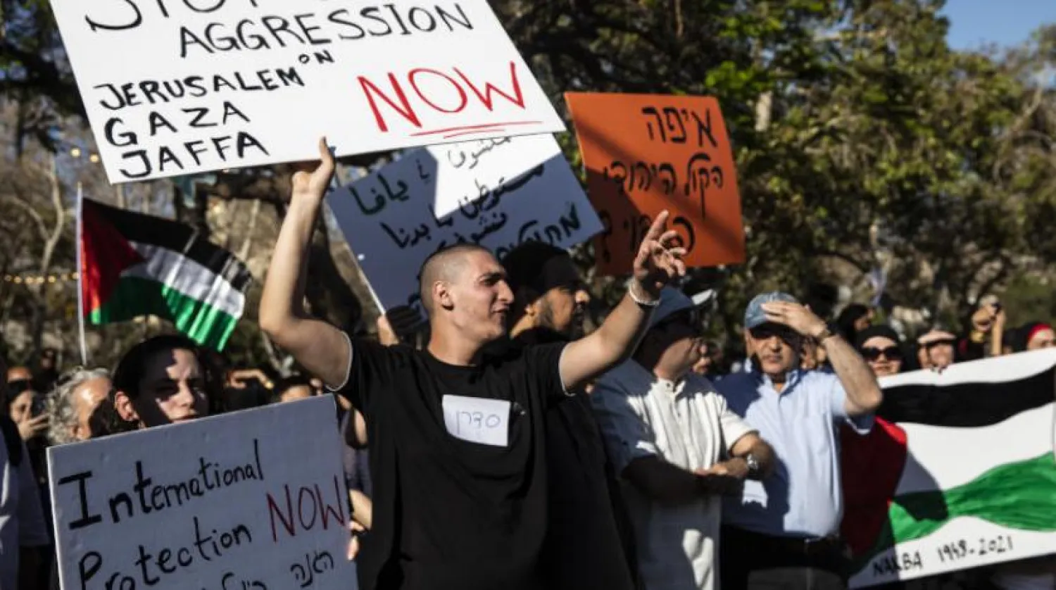 İsrail saldırganlığının sona ermesini talebiyle Yafa’da düzenlenen bir protesto (AP)