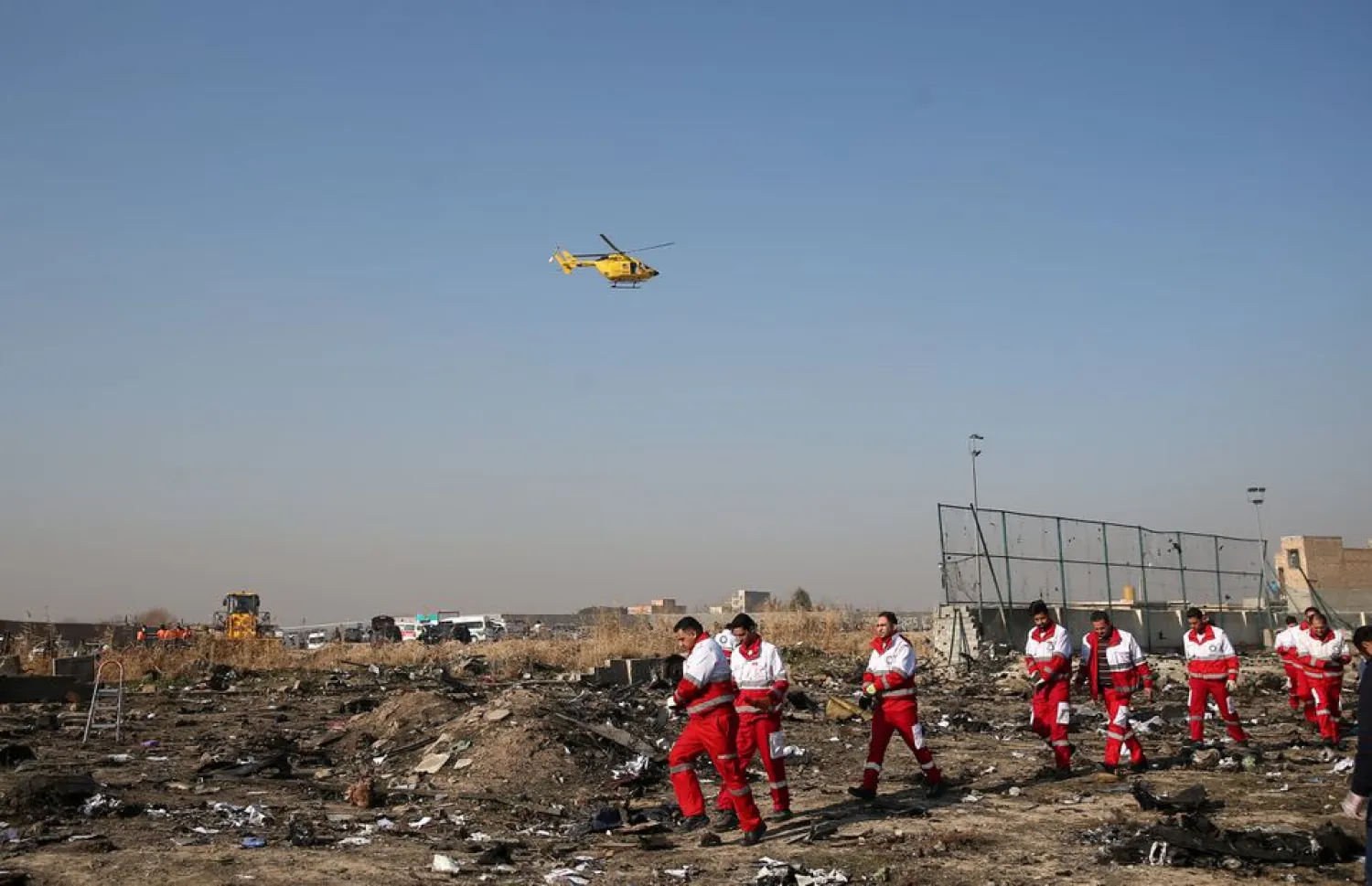 Rescue team works among debris of a plane belonging to Ukraine International Airlines, that crashed after take-off, on the outskirts of Tehran, Iran January 8, 2020. Nazanin Tabatabaee/WANA (West Asia News Agency) via REUTERS