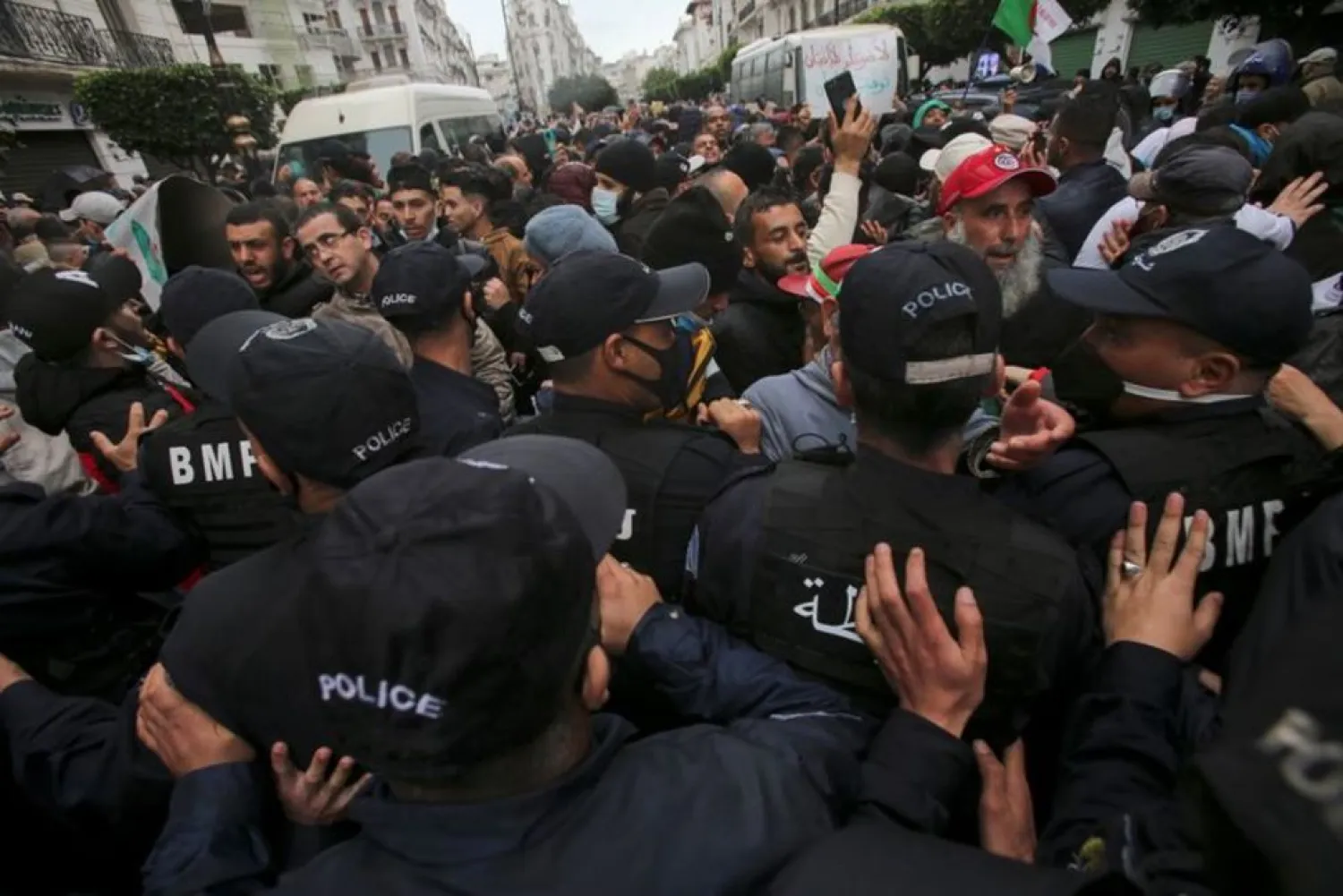 Police officers block demonstrators during a protest marking two years since the start of a mass protest movement demanding political change, in Algiers, Algeria February 22, 2021. (Reuters)