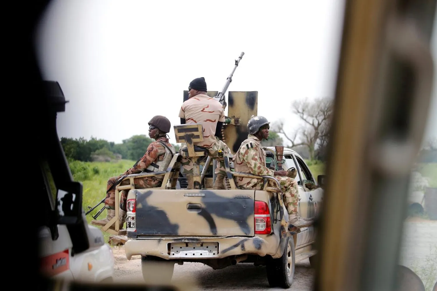 FILE PHOTO: A Nigerian army convoy vehicle drives ahead with an anti-aircraft gun, on its way to Bama, Borno State, Nigeria August 31, 2016. REUTERS/Afolabi Sotunde/File Photo