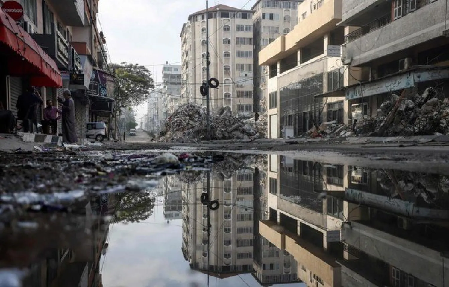 A picture shows a street in Gaza City's Rimal area that was bombed by an Israeli air strike. (File/AFP)
