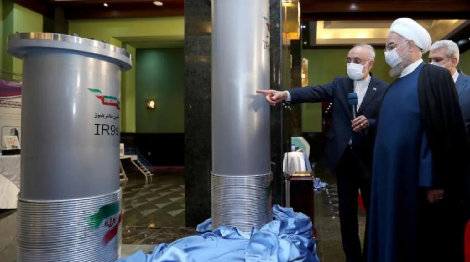 Iranian President Hassan Rouhani touring a nuclear exhibition in Tehran last month (AFP)
