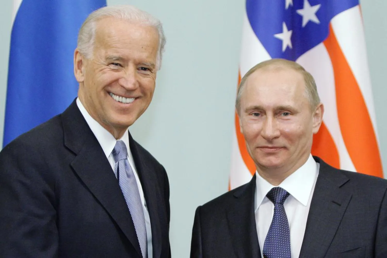 In this March 10, 2011 file photo, then Vice President Joe Biden, left, shakes hands with Russian Prime Minister Vladimir Putin in Moscow, Russia. (AP)