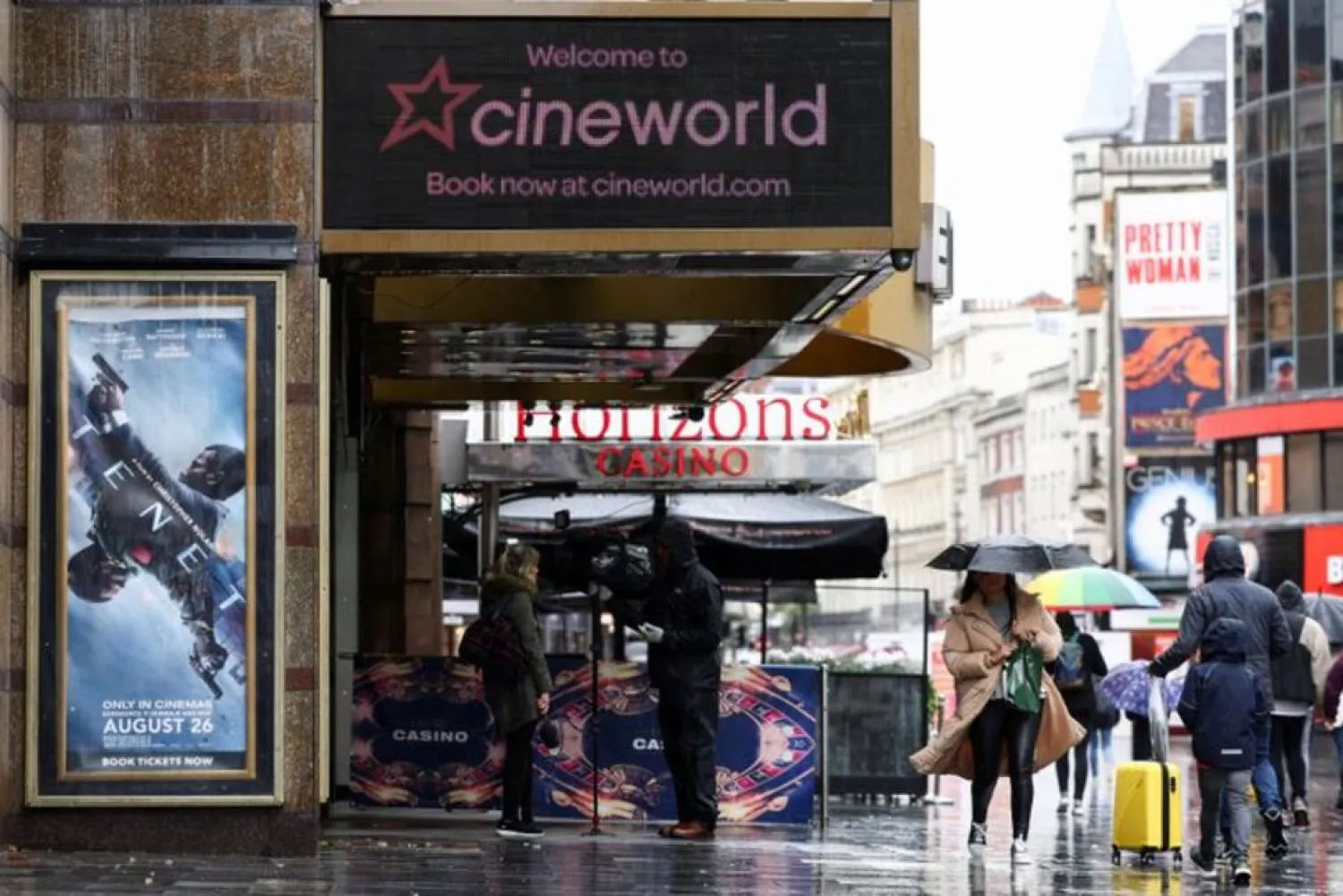 People walk past a Cineworld in Leicester's Square, amid the coronavirus disease (COVID-19) outbreak in London, Britain, October 4, 2020. (Reuters)