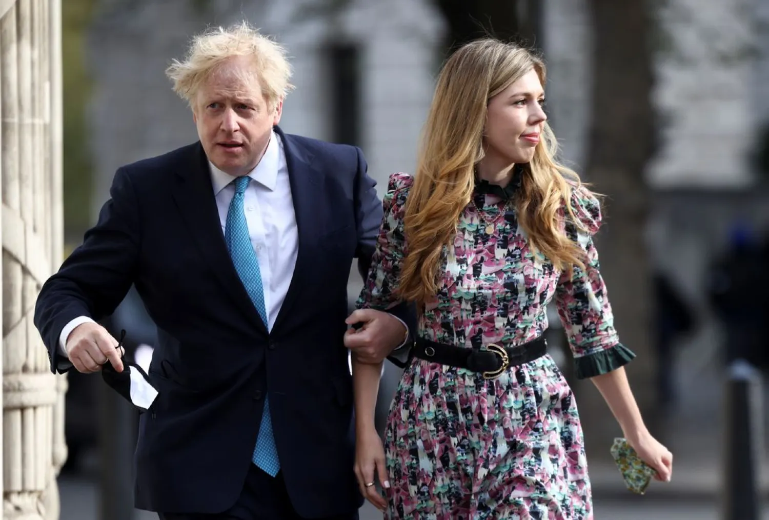 Prime Minister Boris Johnson and Carrie Symonds walk to Westminster polling station to vote, in London, Britain May 6, 2021. (Reuters)