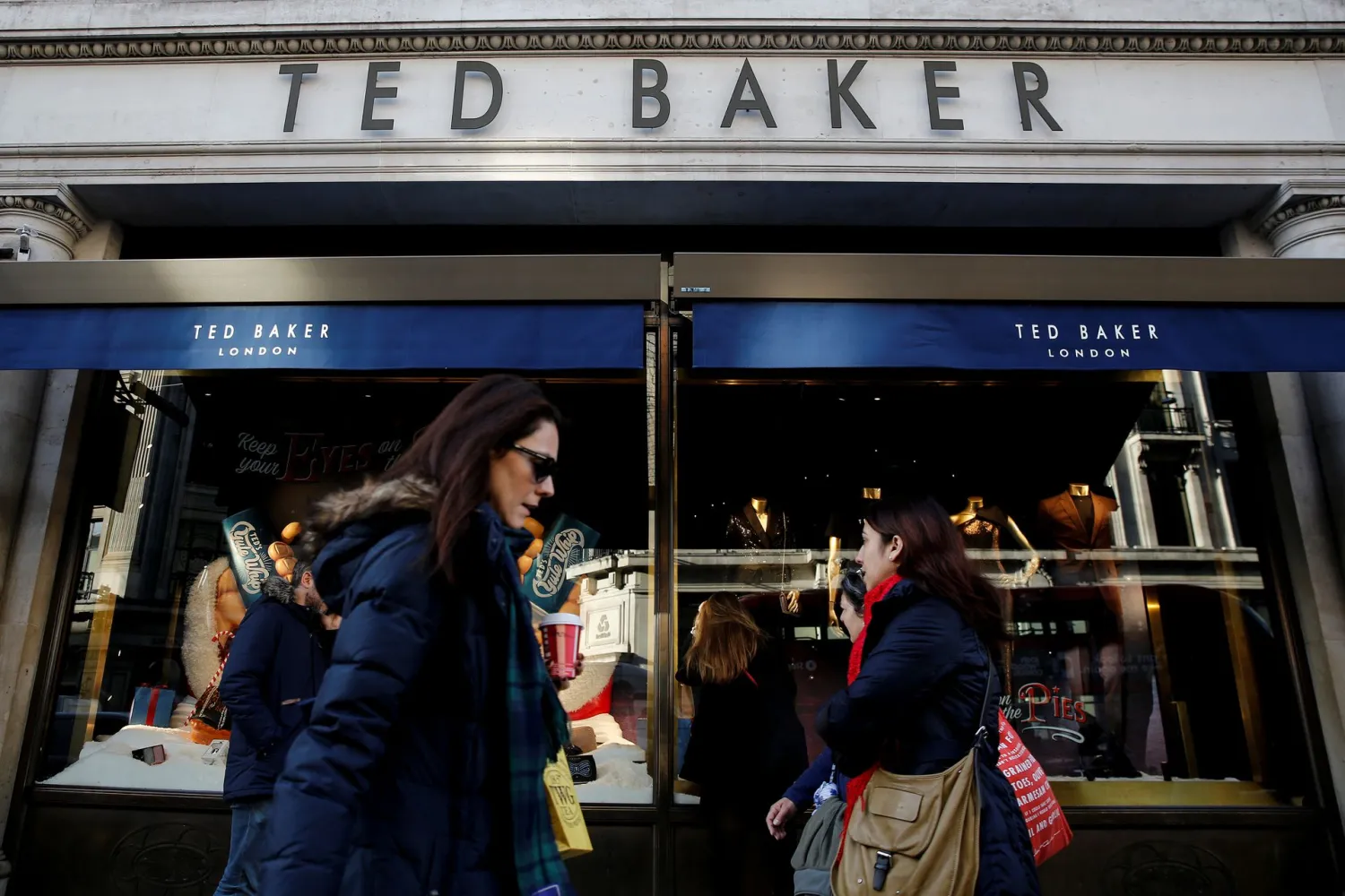 Shoppers walk past a Ted Baker store on Regents Street in London, Britain December 17, 2018. REUTERS/Simon Dawson