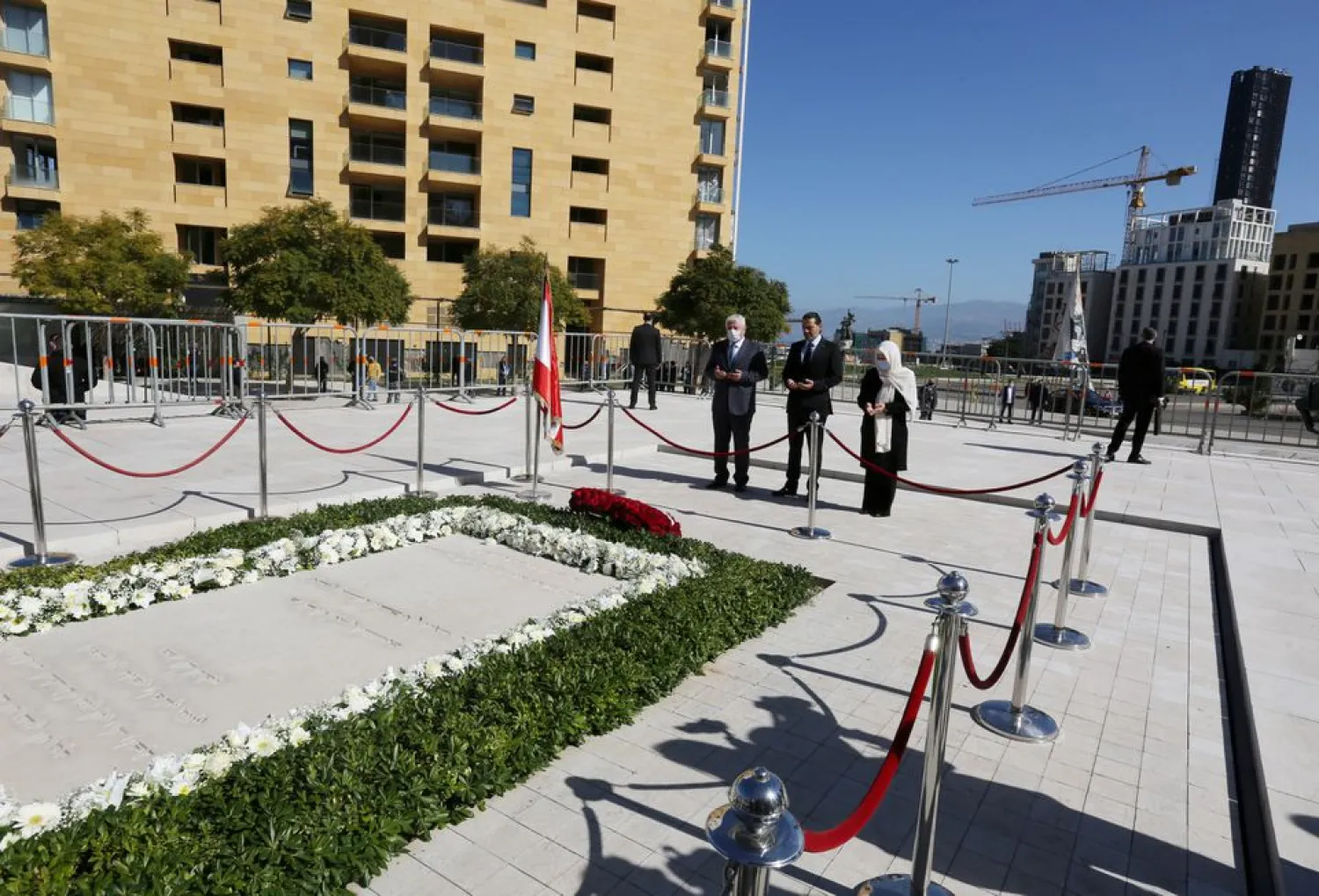 Lebanese Prime Minister-designate Saad al-Hariri and Bahia al-Hariri, the sister of Lebanon's former Prime Minister Rafik al-Hariri, pray at his grave, during the 16th anniversary of his assassination, in downtown Beirut, Lebanon February 14, 2021. (Reuters)