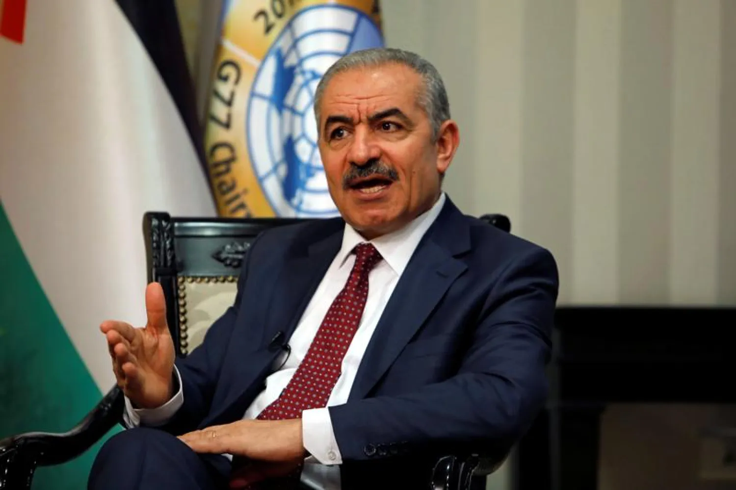 Palestinian Prime Minister Mohammad Shtayyeh gestures during an interview with Reuters in his office in Ramallah, in the Israeli-occupied West Bank, June 27, 2019. (Reuters)
