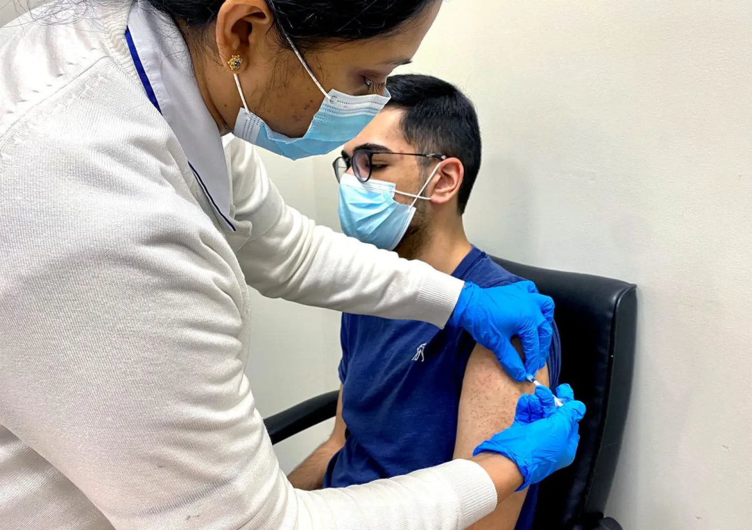 A man receives a dose of a vaccine against the coronavirus disease (COVID-19), in Dubai, United Arab Emirates December 28, 2020. (Reuters)