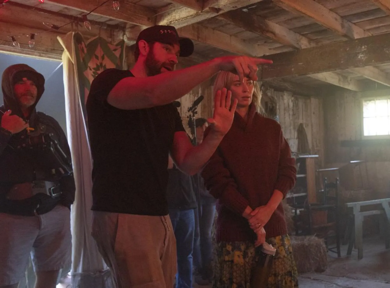 This image released by Paramount Pictures shows director John Krasinski, left, and Emily Blunt on the set of “A Quiet Place Part II.” (Paramount Pictures via AP)