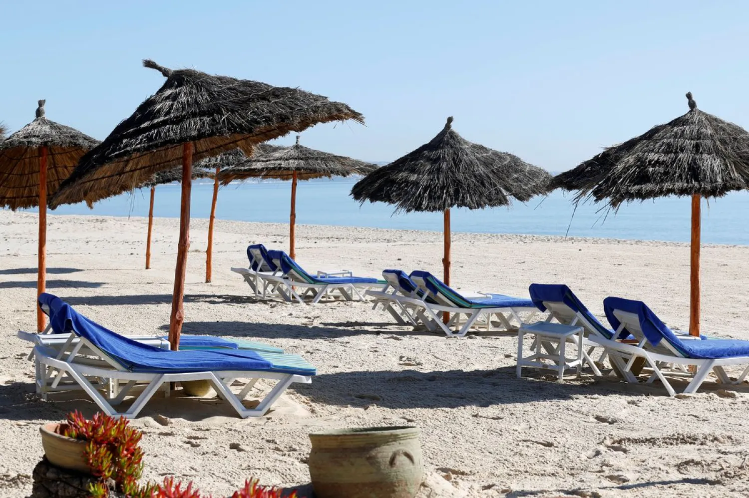 Empty sunbathing chairs are seen on a beach near the Hasdrubal Hotel in Hammamet, Tunisia , March 12, 2020. Reuters