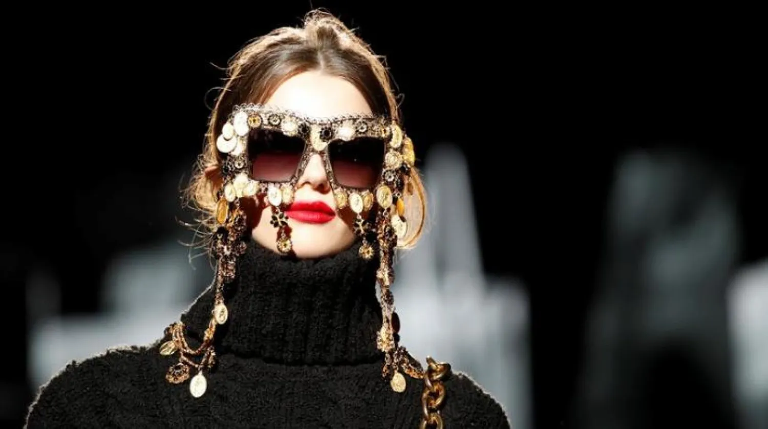 FILE: A model presents a fashion creation. REUTERS/Alessandro Garofalo
