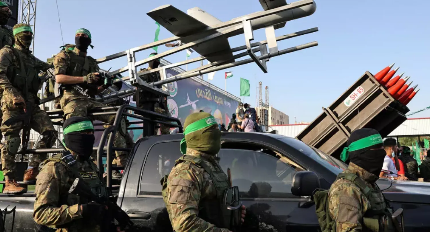 Fighters of the Hamas military wing Ezzedin al-Qassam Brigades display military hardware during a parade in the Gaza city of Rafah a week after Hamas and Israel agreed a ceasefire ending a deadly and devastating 11-day confrontation - AFP