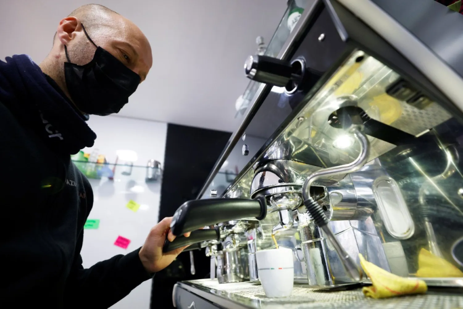 Restaurant worker Franco Giovinazzo prepares coffee, in Rome, Italy, Jan. 14, 2021. (Reuters Photo)