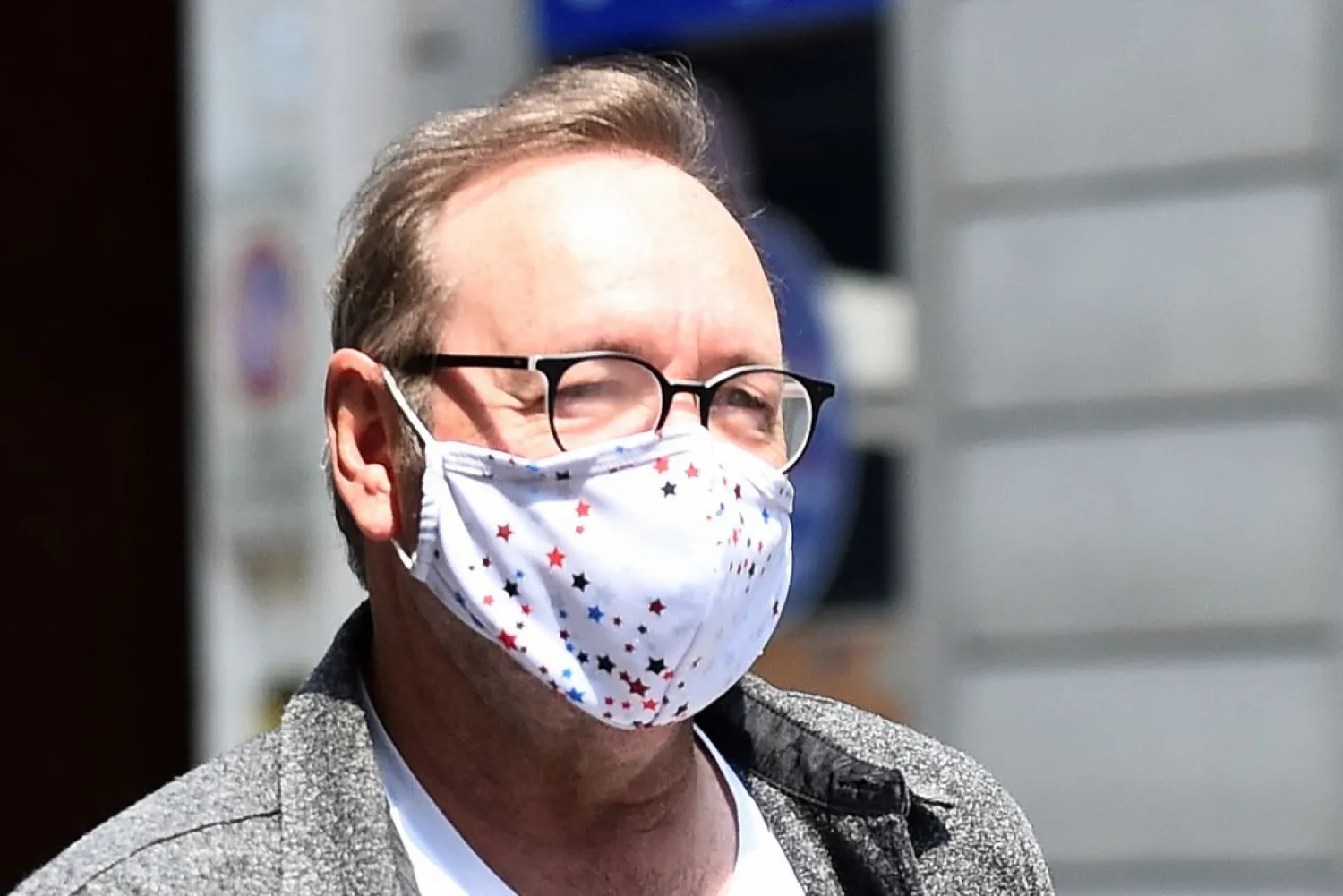 Actor Kevin Spacey walks down Carlo Alberto street as he visits the city, where he is expected to return for a cameo appearance in a low budget Italian film, in Turin, Italy, June 1, 2021. (Reuters)