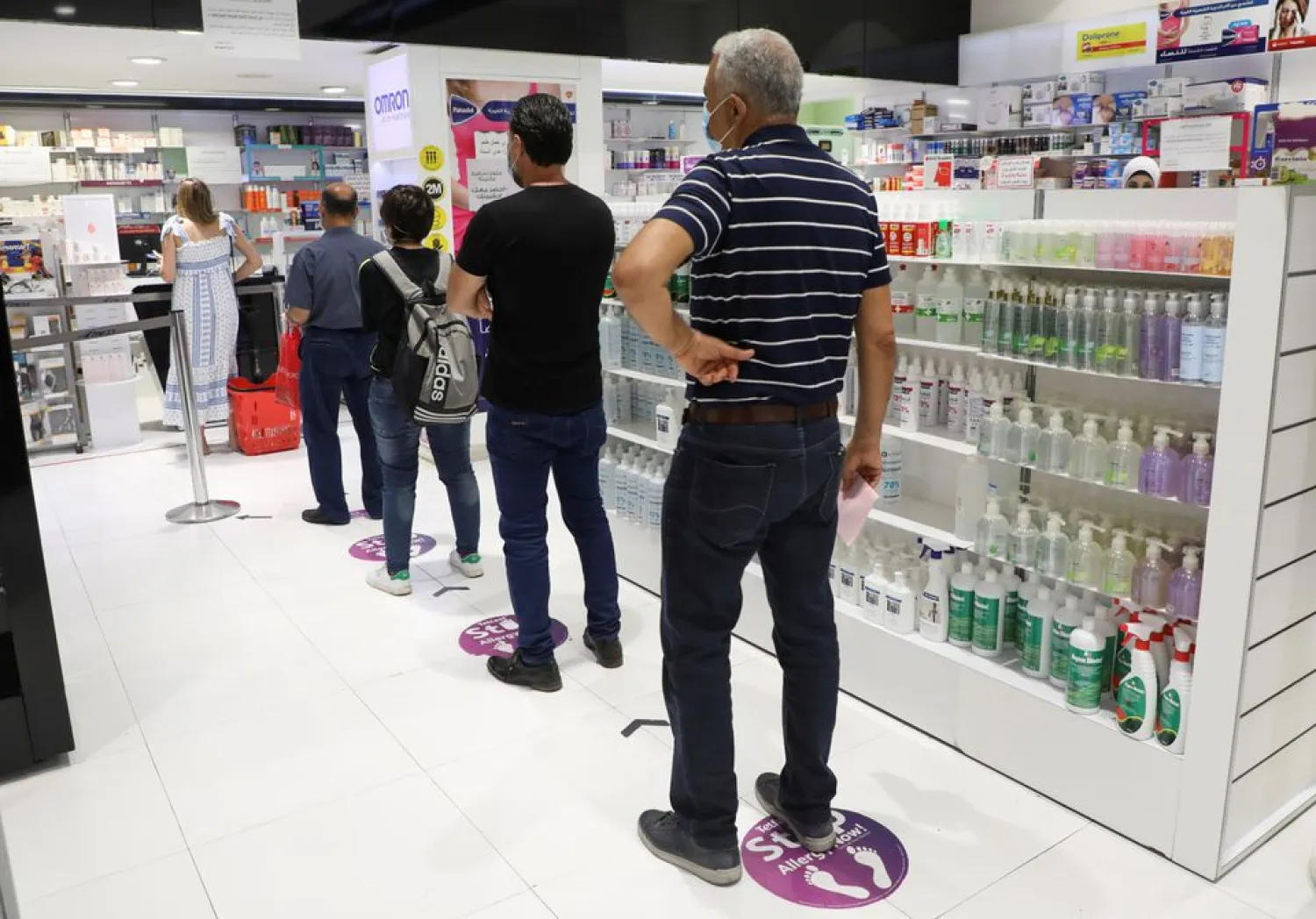 People queue inside a pharmacy in Beirut, Lebanon May 28, 2021. (Reuters)