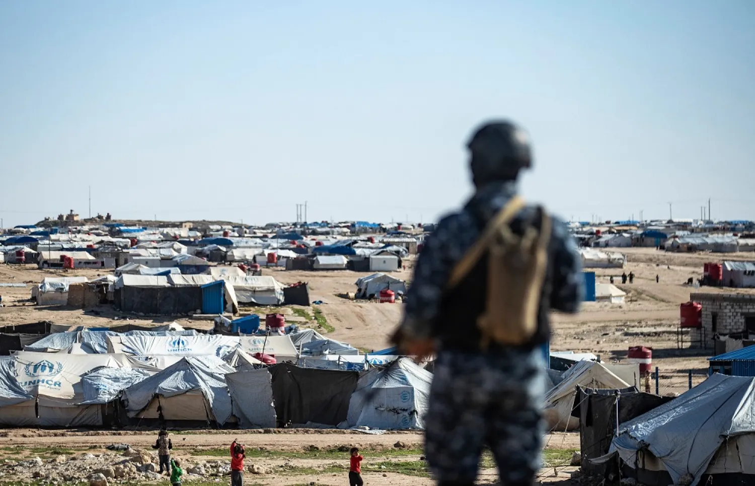 Special forces of the Syrian Democratic Forces keep watch in the vicinity of Al-Hol camp, in Syria's northeast, March 30, 2021. (AFP)