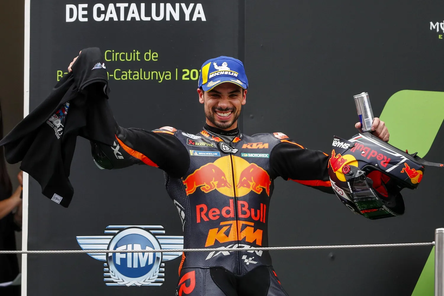 Portugal's Miguel Oliveira of KTM reacts from the podium after winning the Catalunya Motorcycle Grand Prix at the Barcelona Catalunya racetrack in Montmelo, near Barcelona, Spain, Sunday, June 6, 2021. (AP Photo/Joan Monfort)