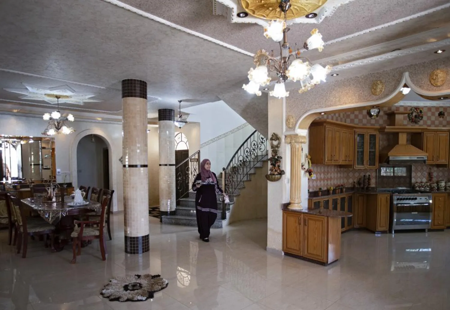 Sanaa Shalaby walks in her home in the West Bank village of Turmus Ayya, Thursday, June 3, 2021. (AP)