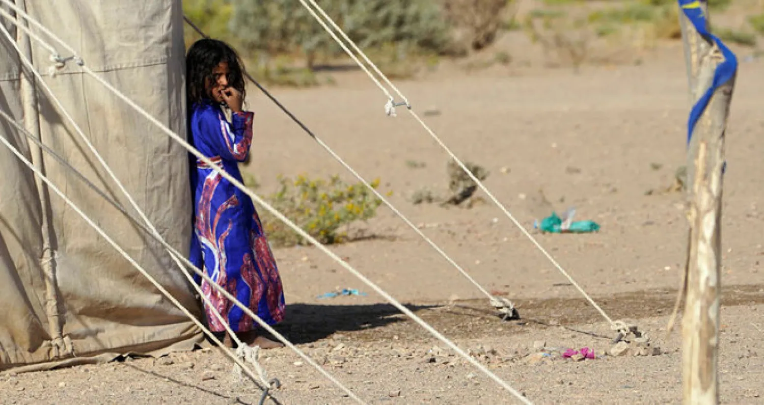 Girl biting her fingernails near a tent in Yemen, AFP 

